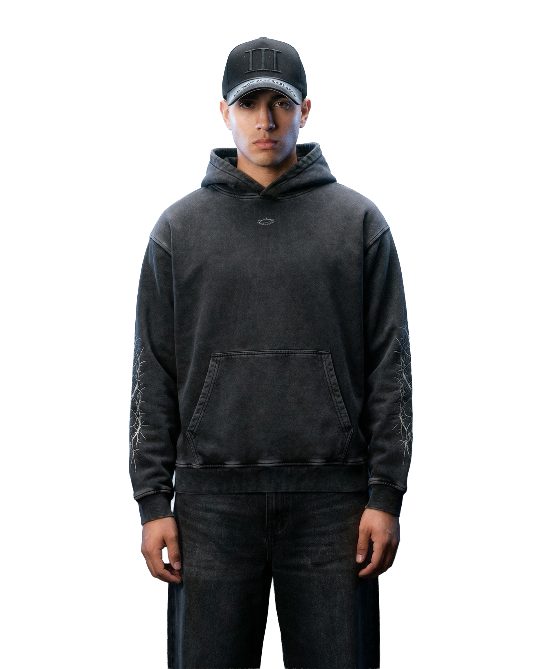 Person wearing a black hoodie and cap on a white background