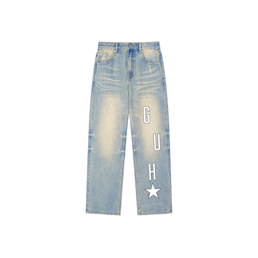 Light blue jeans with 'G U H' text and star design on a white background
