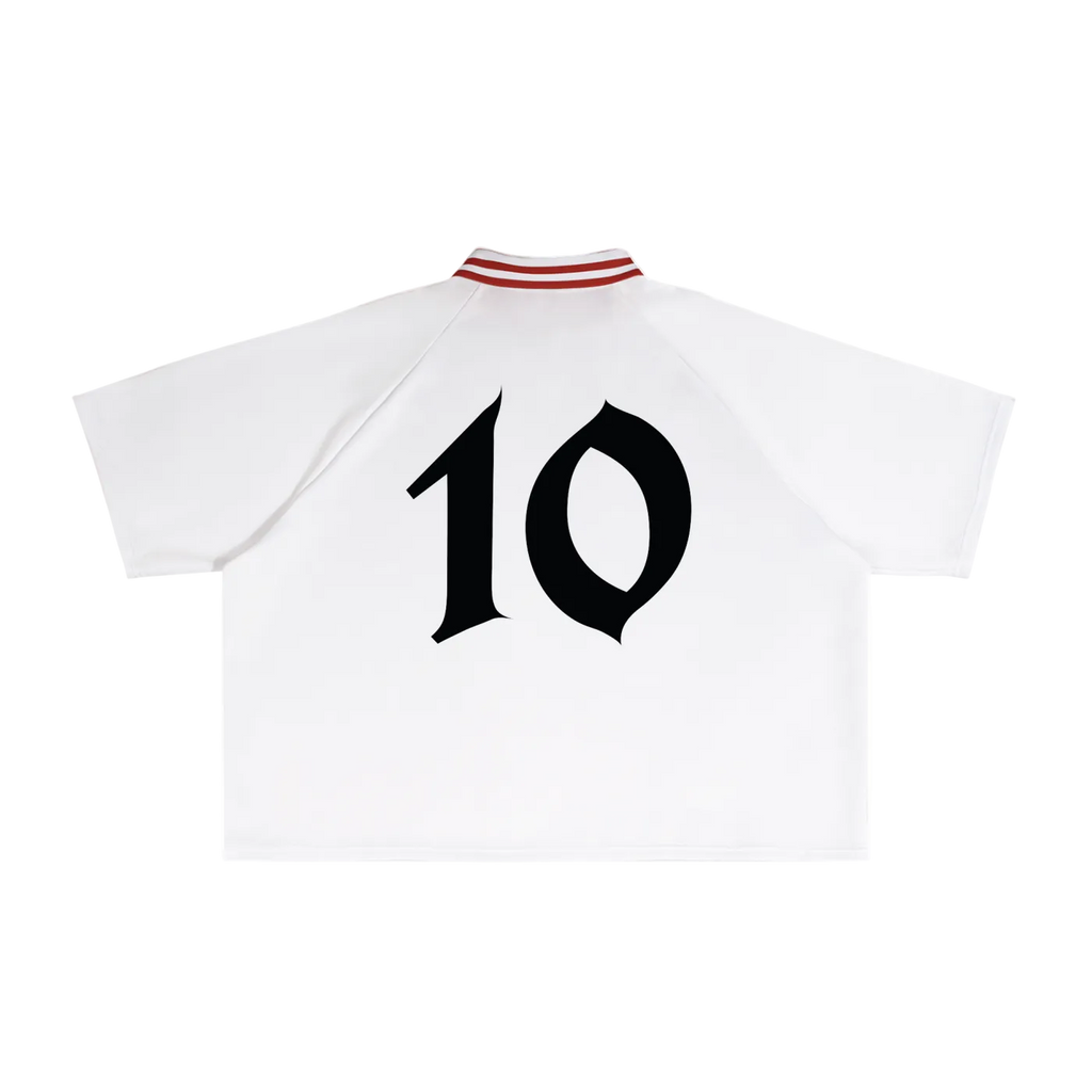 White polo shirt with black number 10 and red trim on a white background