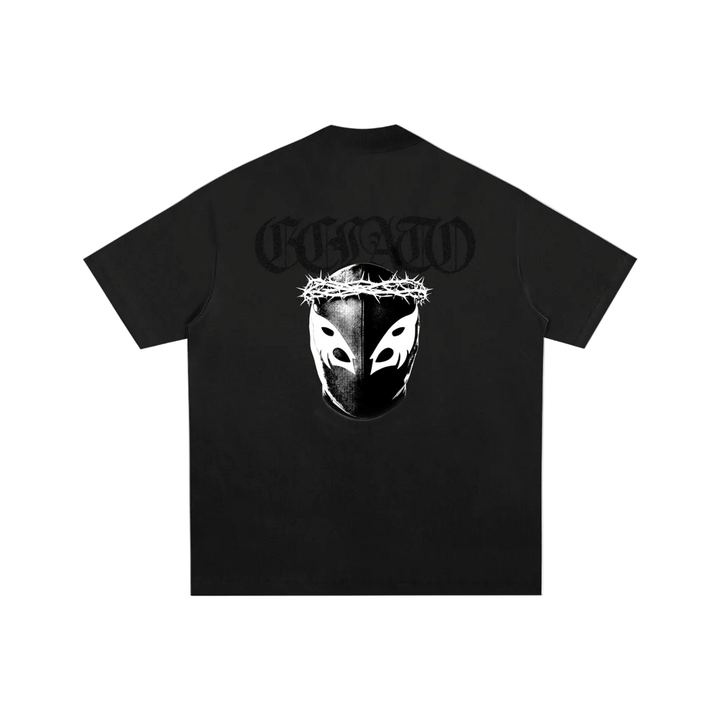 Black t-shirt with a graphic design on the back featuring a mask and text, on a white background.