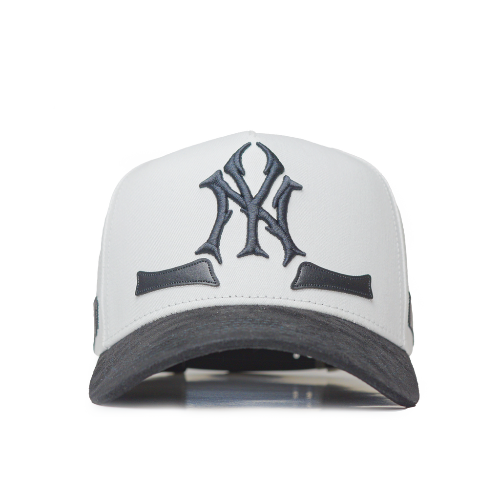 White and black cap with a logo on a white background