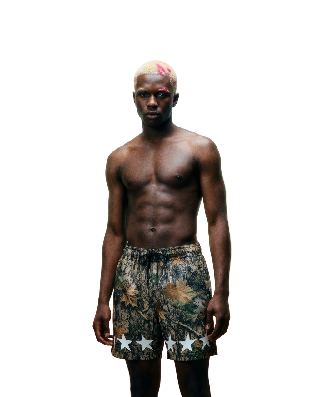 Man wearing camouflage shorts with star patterns against a gradient background