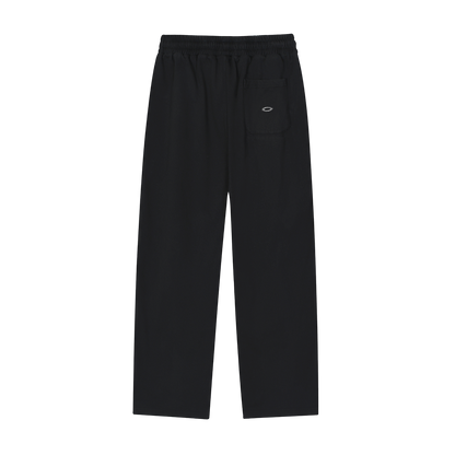 Black pants with a brand logo on a white background