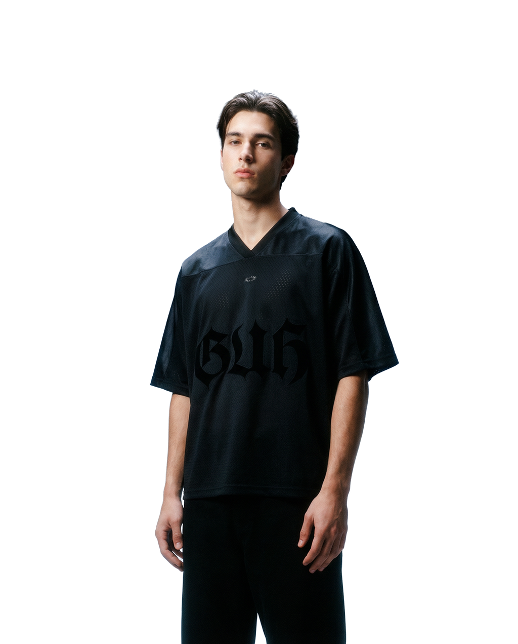 Person wearing a black shirt with a logo on a white background