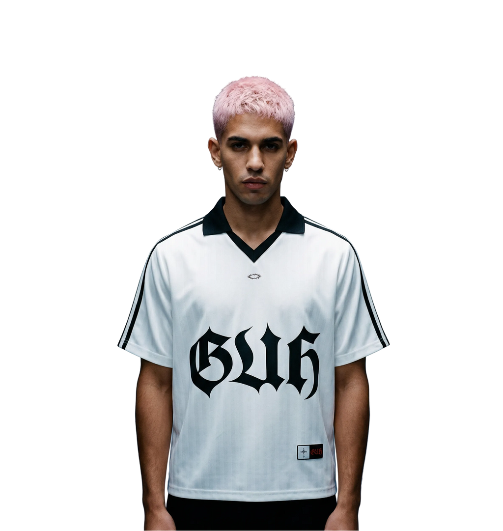 Person wearing a white sports jersey with black text on a blue background