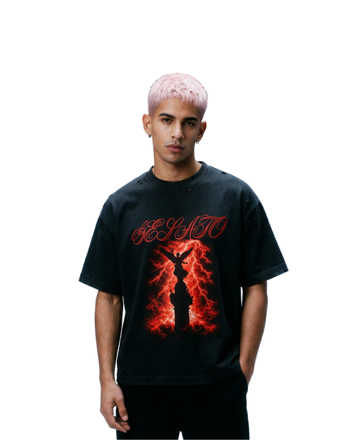 Person wearing a black t-shirt with a red graphic design on a gradient blue background